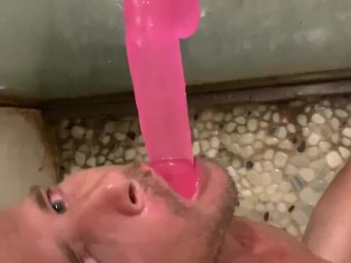 Cute boy having fun with dildo in shower