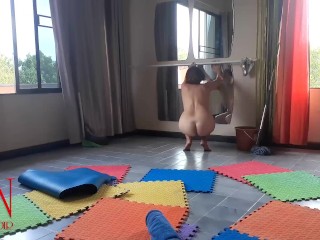 Nudist maid cleans the yoga room. A naked cleaner cleans mirrors, sweeps and mops the floor. с1