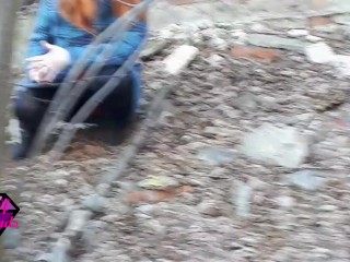 Desperate Redhead peeing in the forest ruins.