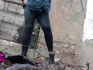 Desperate Redhead peeing in the forest ruins.