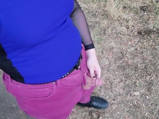 Tgirl takes a piss out in the open