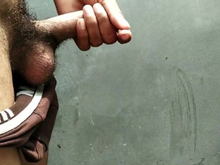 Indian boy pissing in bathroom