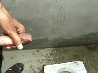 Indian boy pissing in bathroom