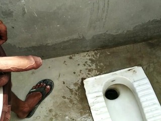 Indian boy pissing in bathroom