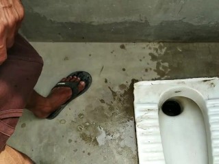 Indian boy pissing in bathroom