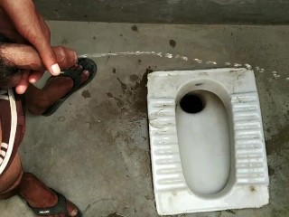 Indian boy pissing in bathroom