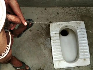 Indian boy pissing in bathroom