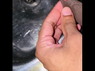 Foreskin fetish play while pissing into the sink 