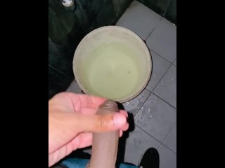 Pissing into a bucket at the gym foreskin fetish pissing at the gym bathroom foreskin pulled