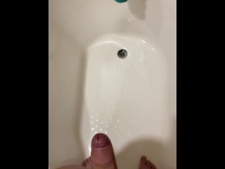 Guy desperately holding his piss until he loses control, spraying his piss everywhere,then orgasming