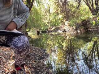 MILF dressed in leggings pissing in the river