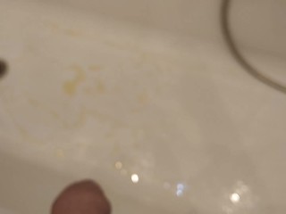 Guy pissing in the bath