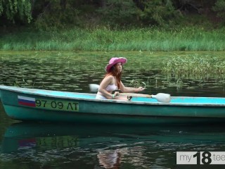 Cute girl decided to go fishing and caught a dildo and fucked herself in the boat