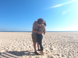 Hot teen couple in love kissing on a sandy beach