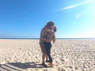 Hot teen couple in love kissing on a sandy beach