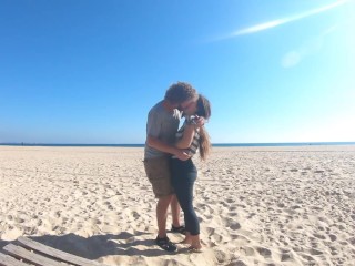 Hot teen couple in love kissing on a sandy beach