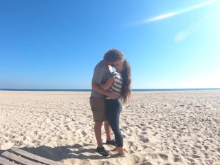 Hot teen couple in love kissing on a sandy beach