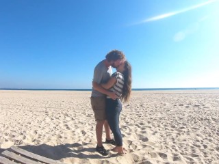 Hot teen couple in love kissing on a sandy beach