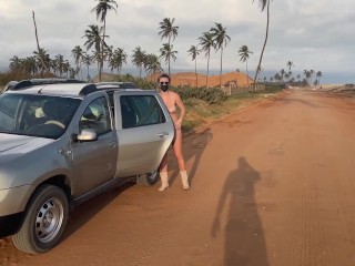 Busty girl walking naked around the car