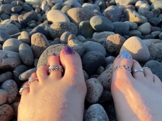 Hot and sexy feet of Mistress Lara in the sunset on public beach