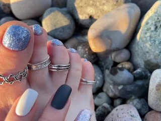 Hot and sexy feet of Mistress Lara in the sunset on public beach