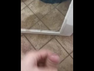 Chubby guy jerking off in front of the mirror and cumming on the floor