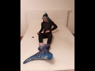 Mermaid Fin and Wetsuit playing