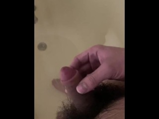 Stroking my soft hairy girl dick in the shower feels so good under the water