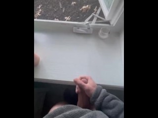 Jerking off in front of an open window