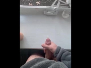 Jerking off in front of an open window