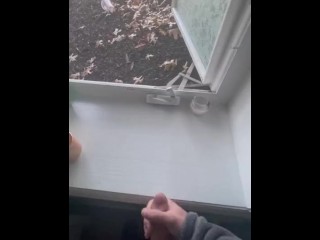 Jerking off in front of an open window