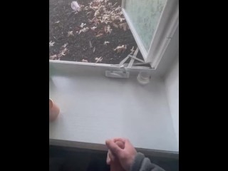 Jerking off in front of an open window