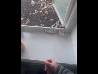 Jerking off in front of an open window