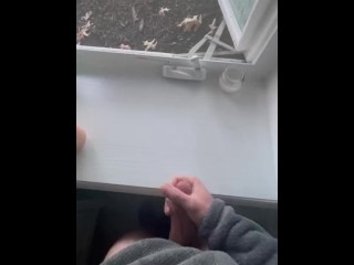 Jerking off in front of an open window