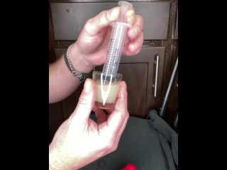 loading a syringe of my thawed cum loads to inject into my wife’s pussy (surprise)