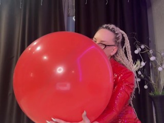 Looner girl in glasses and red PVC dress blow BIG red balloon and pop it with ass. DM to get full