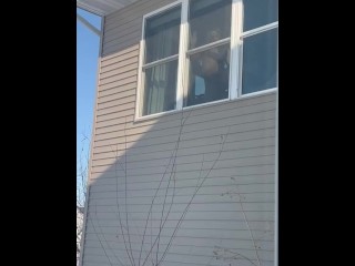 Public Masturbation: sexy horny MILF gets caught by neighbors masturbating in window with big dildo.