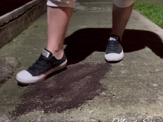 Crushing oreos in public with black converse chucks