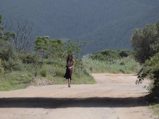 Walking Naked on open road under a bridge