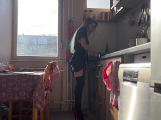 Sunny morning and she is making coffee in stokings and hills. Voyeurism.