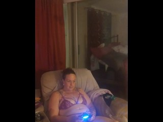 Amateur milf takes off her mini dress and lays on the couch in lingerie playing video games