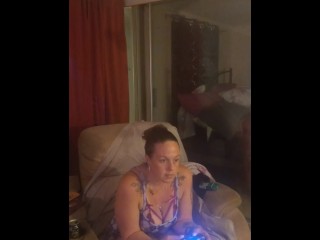 Amateur milf takes off her mini dress and lays on the couch in lingerie playing video games