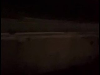 Standing naked at side of road trying to hide from cars