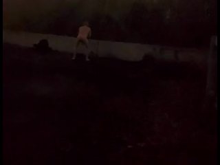 Standing naked at side of road trying to hide from cars