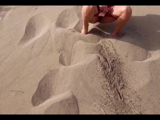 Tour guide in the middle of desert outdoors is watched while she pees on sand in public open pussy