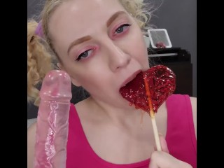 A teenage girl plays with her pussy, fucks her pussy with a pink dildo, and then sucks it and a loll