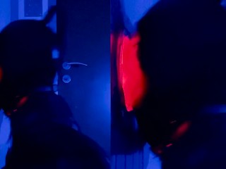 sissy with latex mask sucking cock at gloryhole