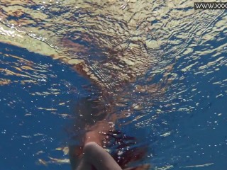 Tiffany blonde perfect round booty teen swims underwater and undresses