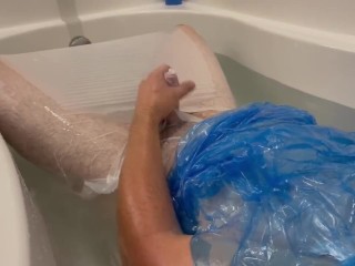 Plastic Bag Man taking a fun bath