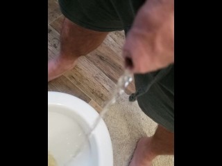 Big  natural uncut cock pissing on the morning thru the foreskin